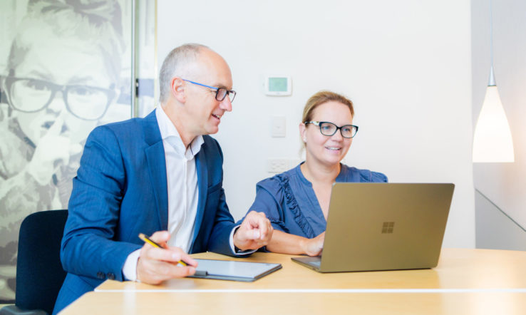 Neil Outsourcing accountants reviewing an audit file together on a laptop